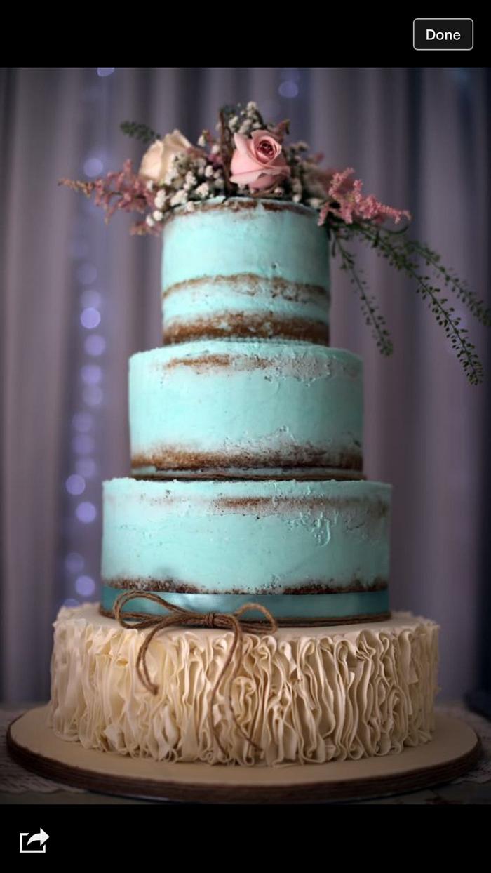 Semi naked teal buttercream with sugarpaste ruffles 