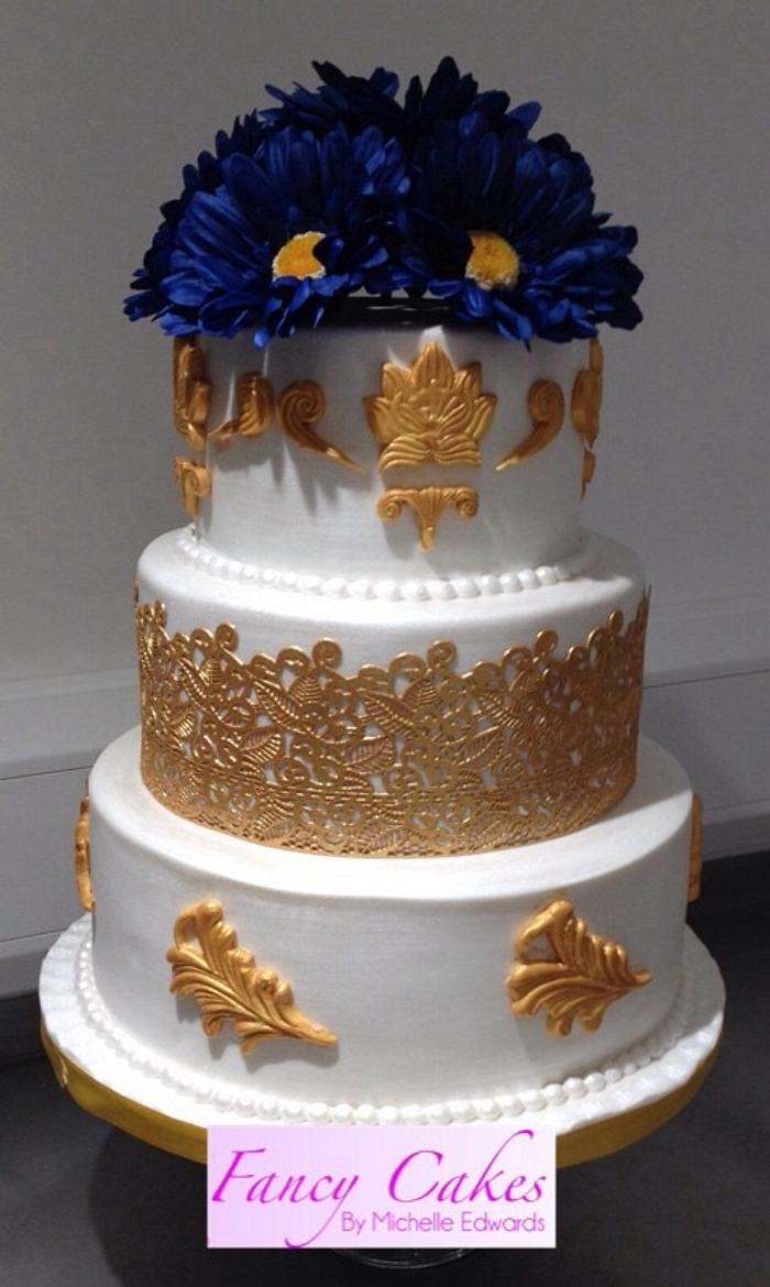 Gold and navy blue wedding cake 