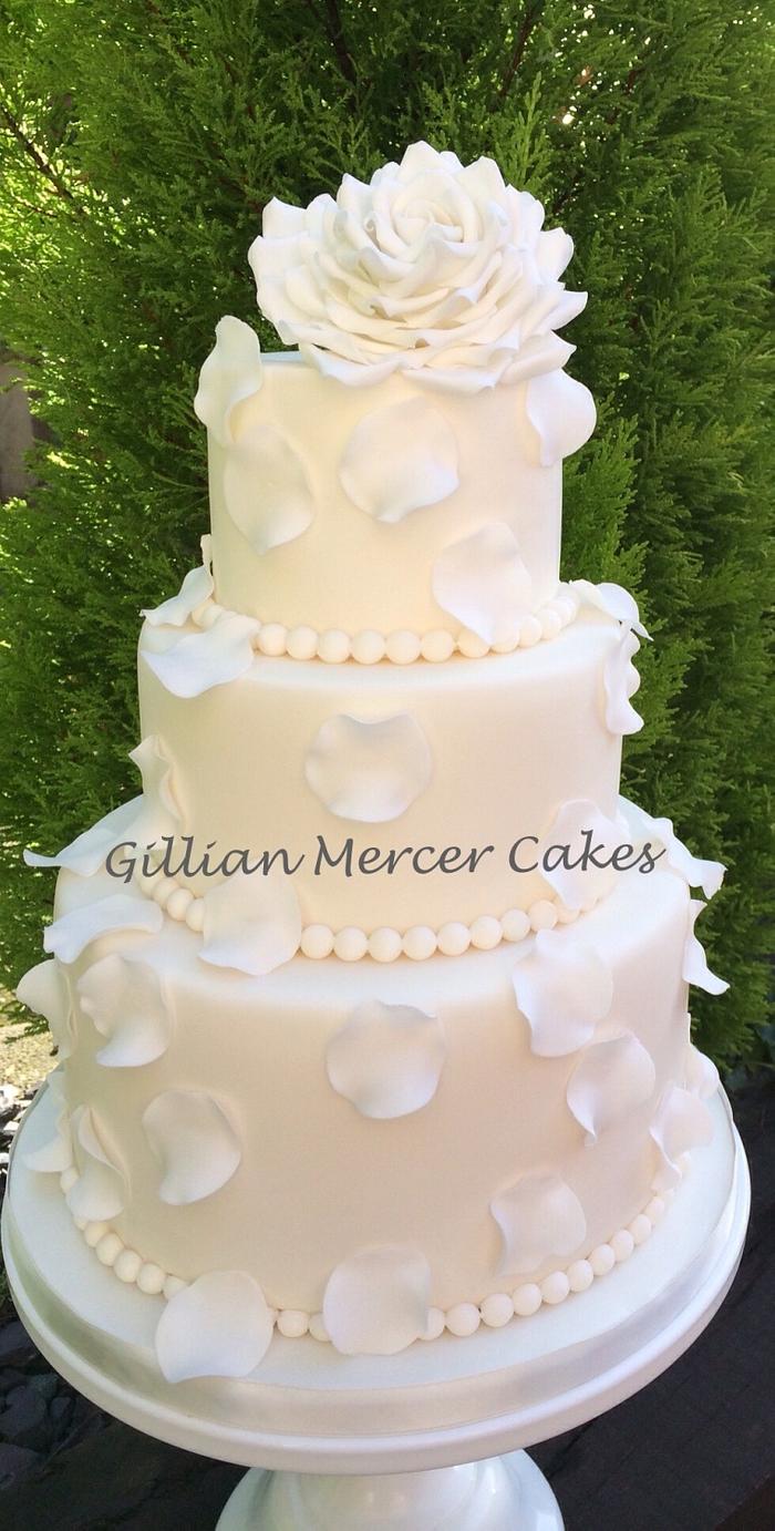 Petals and pearls white wedding cake