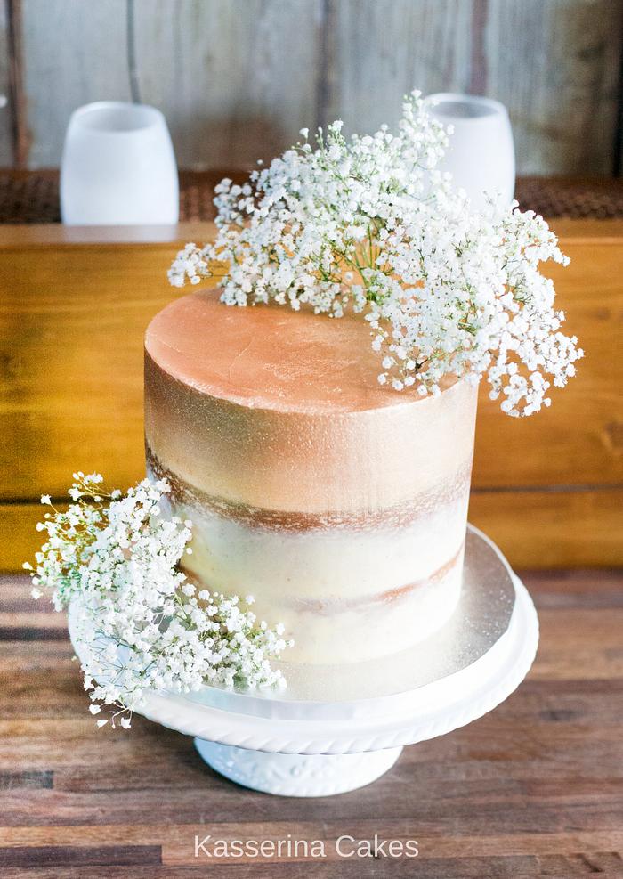Single tier semi-naked cake with gold ombre