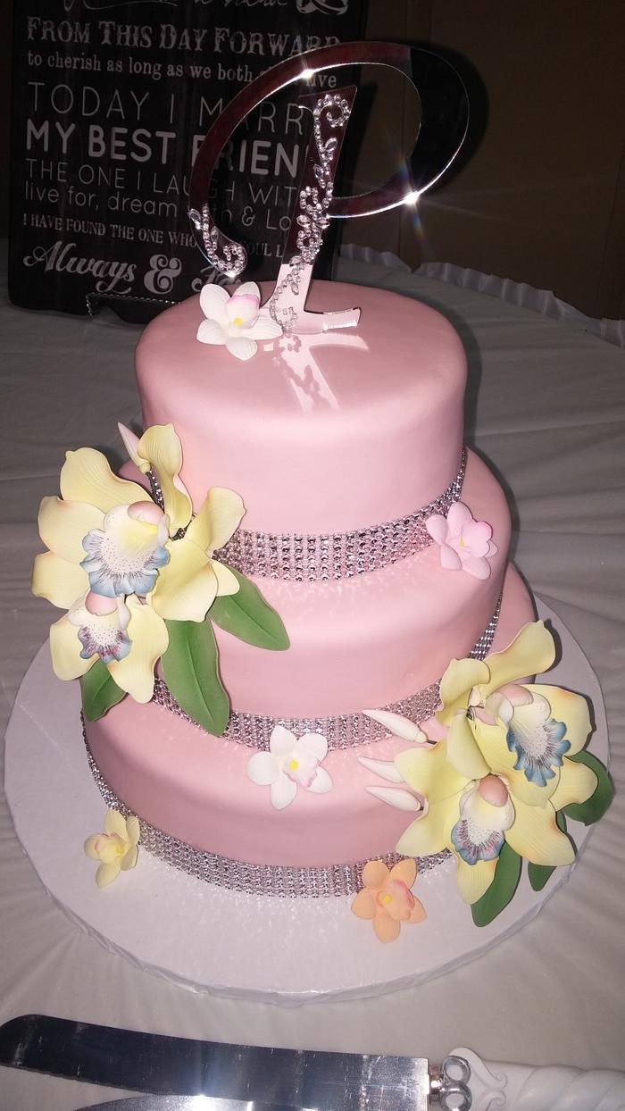 Pink wedding cake and cupcakes