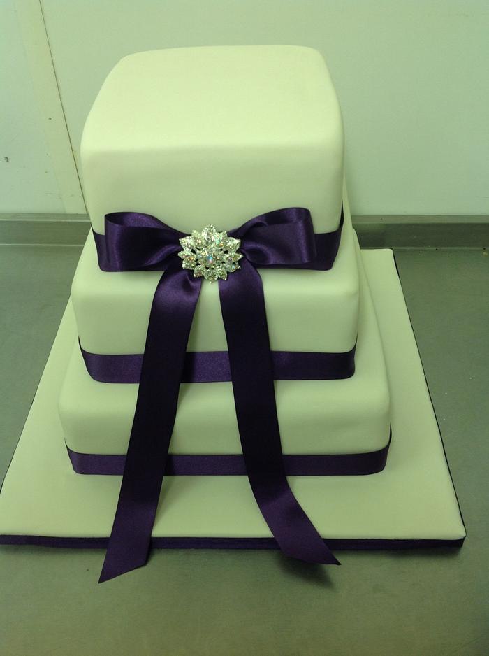 Ivory and purple wedding cake