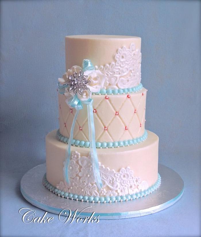 Buttercream accented with Tiffany Blue Wedding