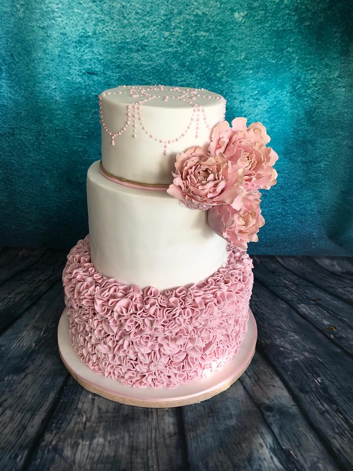 Pastel pink and gold ruffle cake