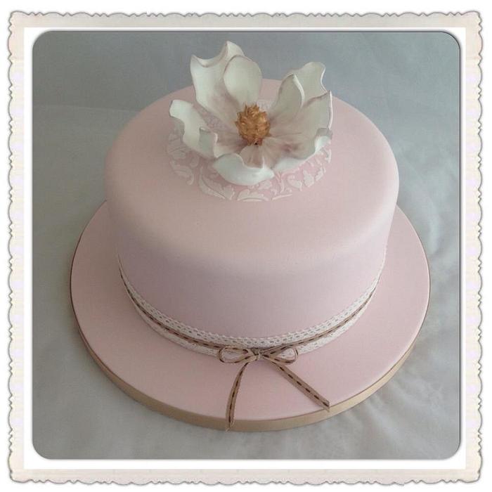 Vintage pale pink Magnolia lace birthday cake.