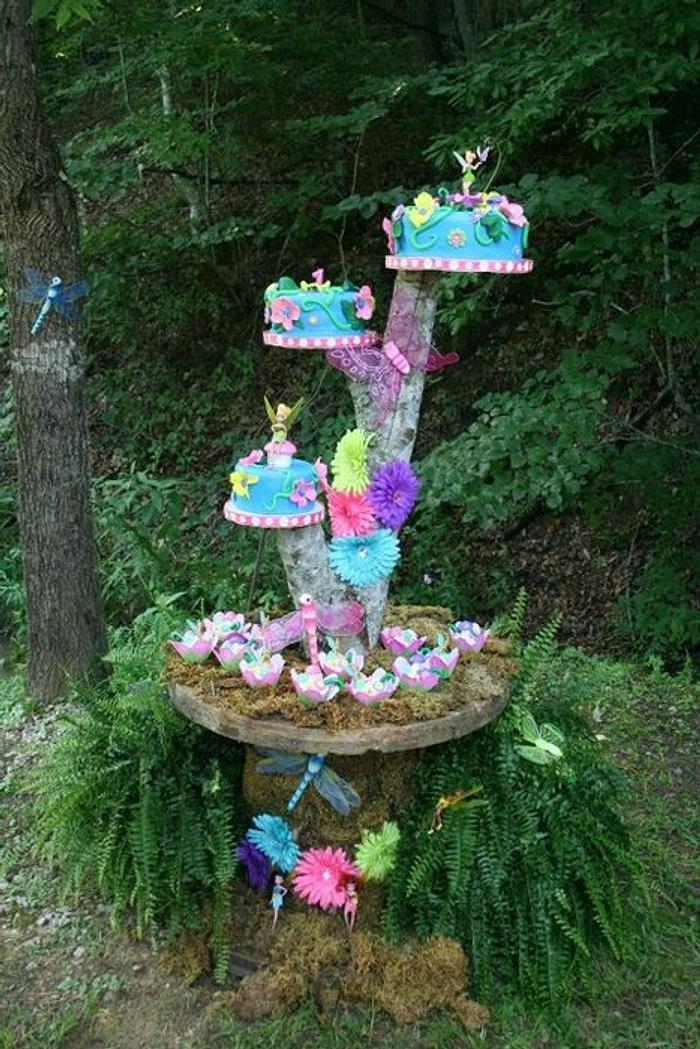 Tinkerbell and her fairy friends on a cool cakestand in the garden :)