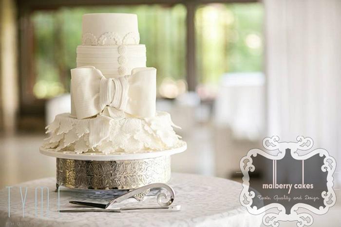 White wedding cake with bow
