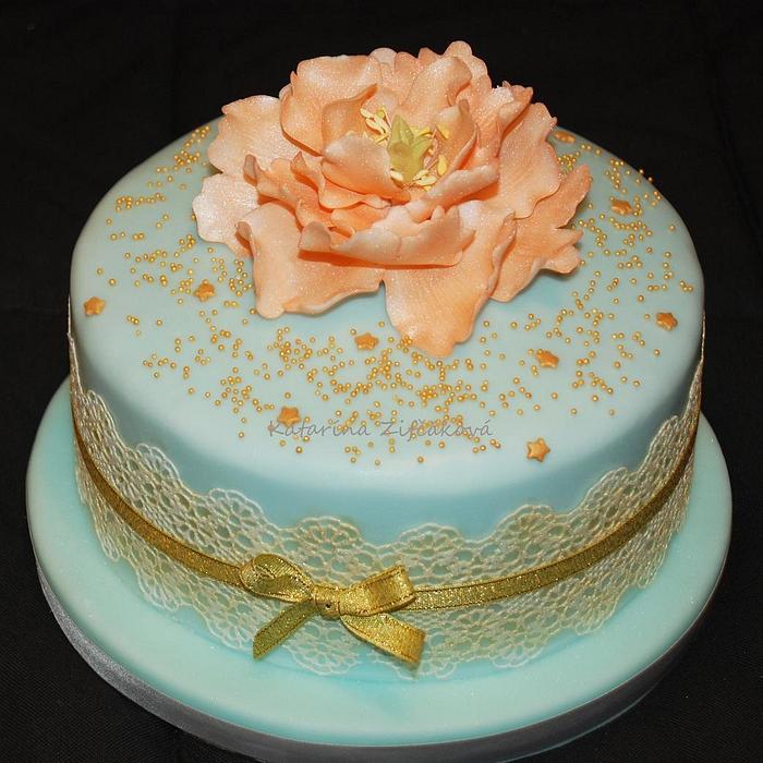 simply cake with lace and flower