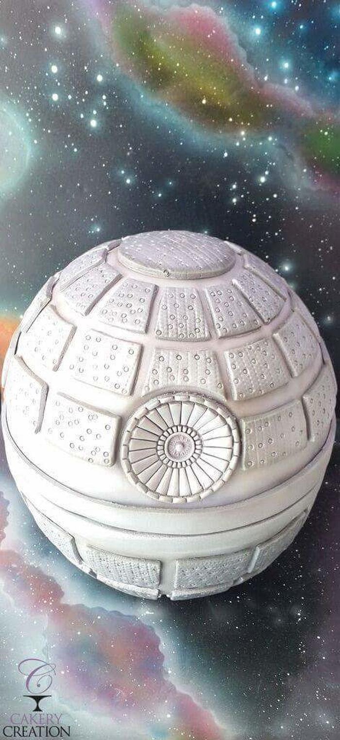 Death Star cake with airbrushed galaxy board and backdrop