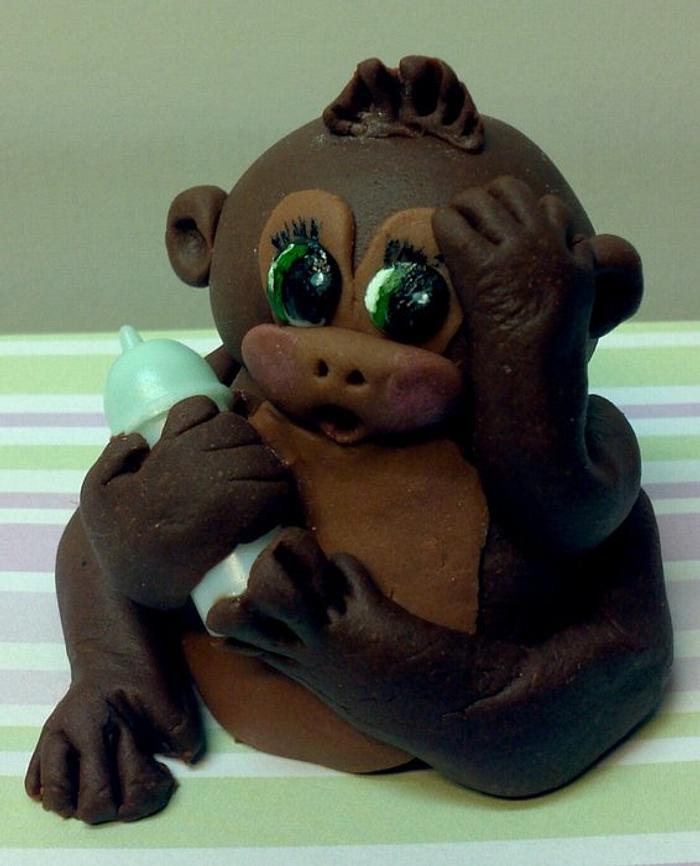 Baby fondant monkey with its bottle