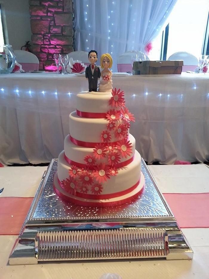 Pink daisy wedding cake