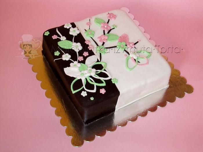 White/brown cake with flowers