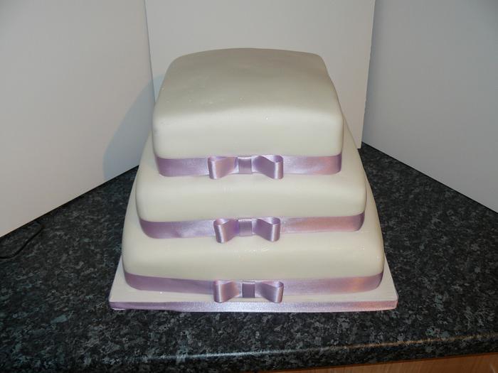Plain 3tier square with lilac ribbons