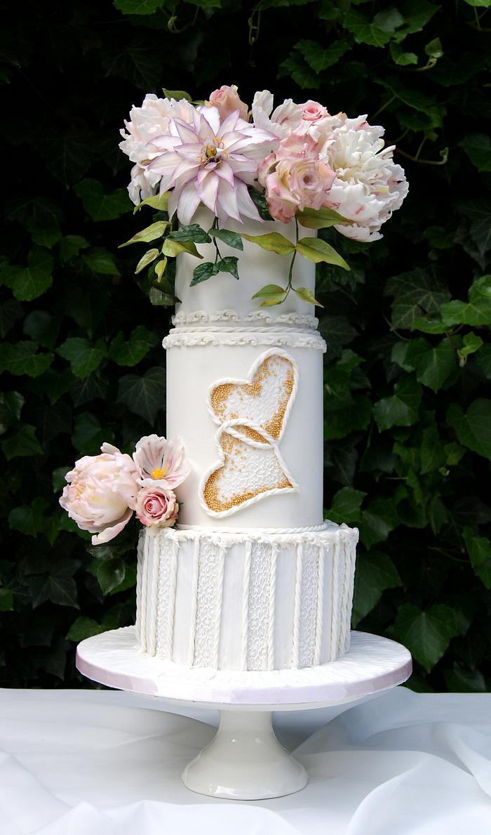 White wedding cake and flowers