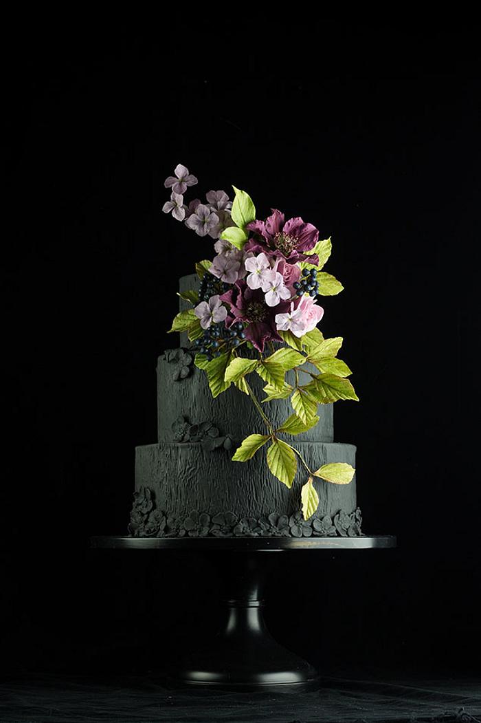 Black wedding cake with clematis sugarflowers