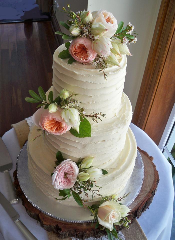 vintage rustic white chocolate wedding cake with fresh roses