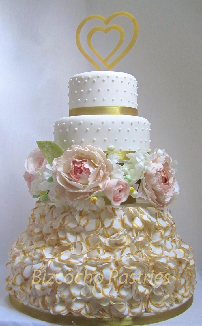 Golden ruffles and flowers wedding cake