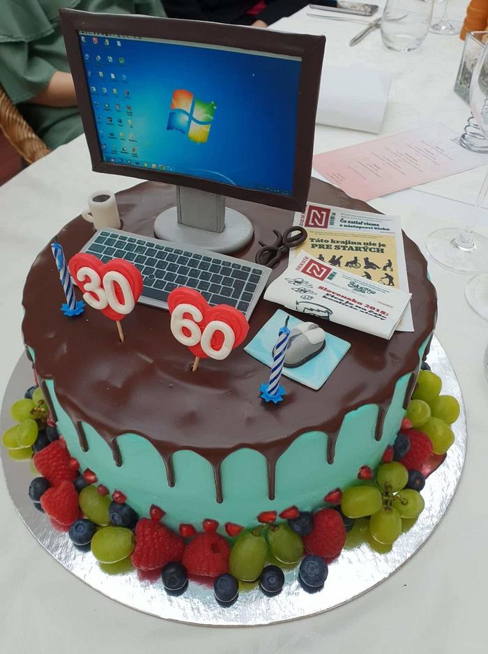 Cake with PC and favourite newspaper