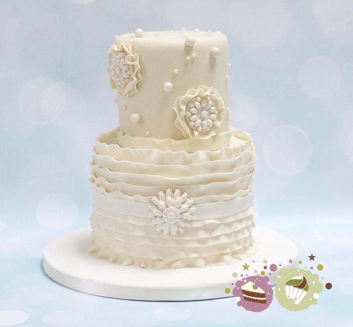Two tier ruffles, pearls and 'bling' wedding cake