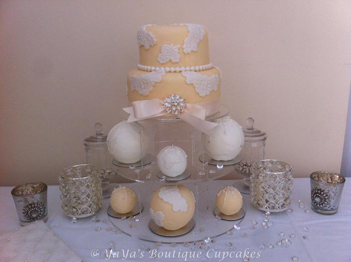 Lace appliqué cake with matching Sphere cakes