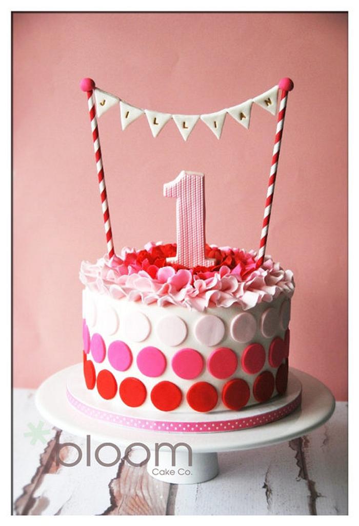 Red, pink and white gradient polka dots and ruffle cake