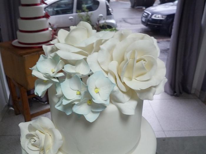 Wedding cake white roses and hydrangea