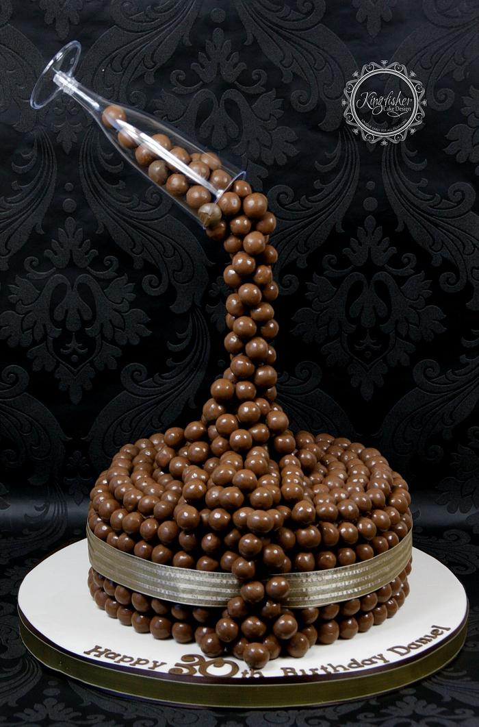 Malteasers pouring from a Champagne Flute