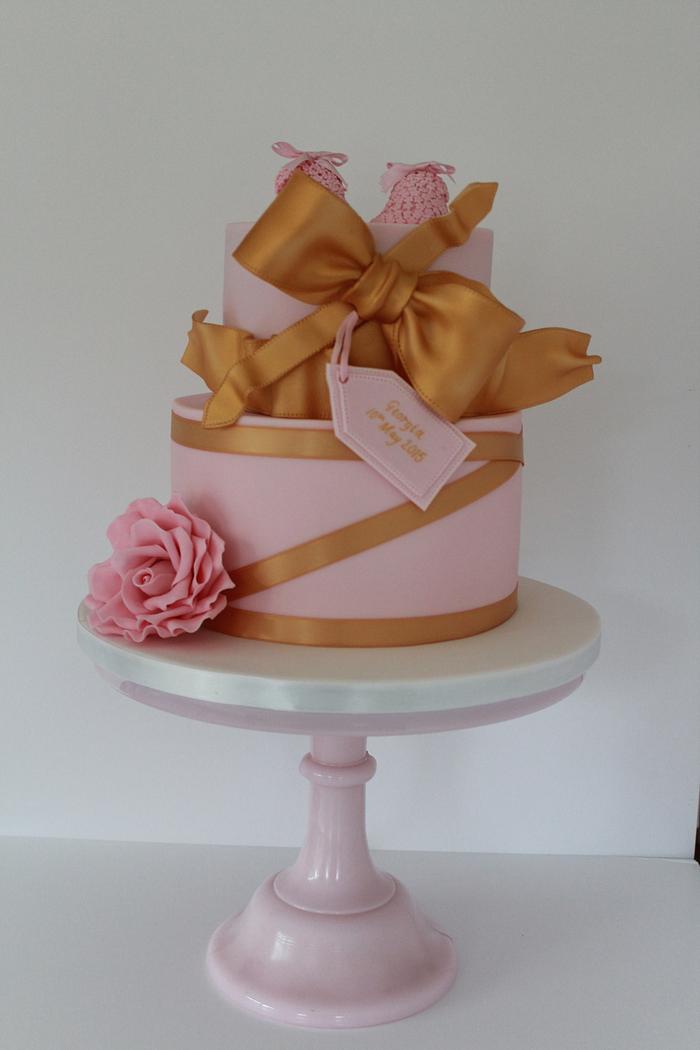 Baby shoe pink and Gold cake 