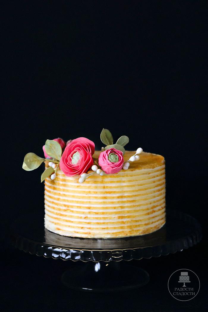 gold cake with sugar flowers