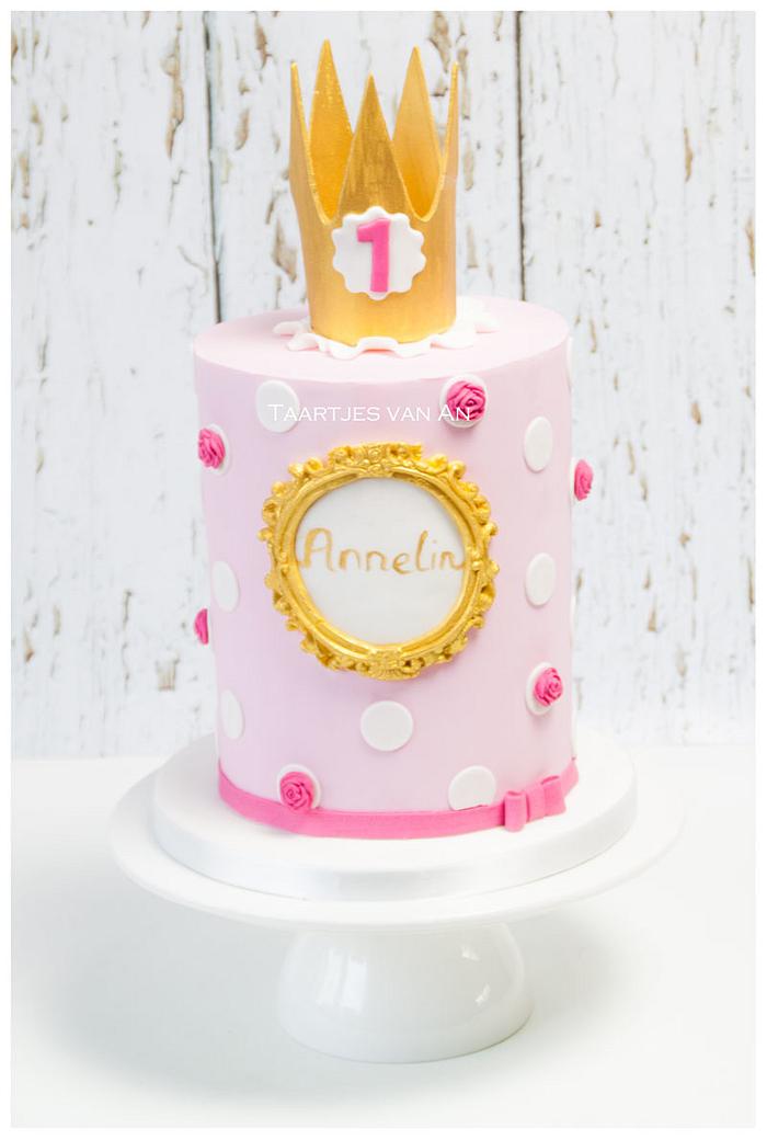 1st birthday cake in soft pink and bright gold.