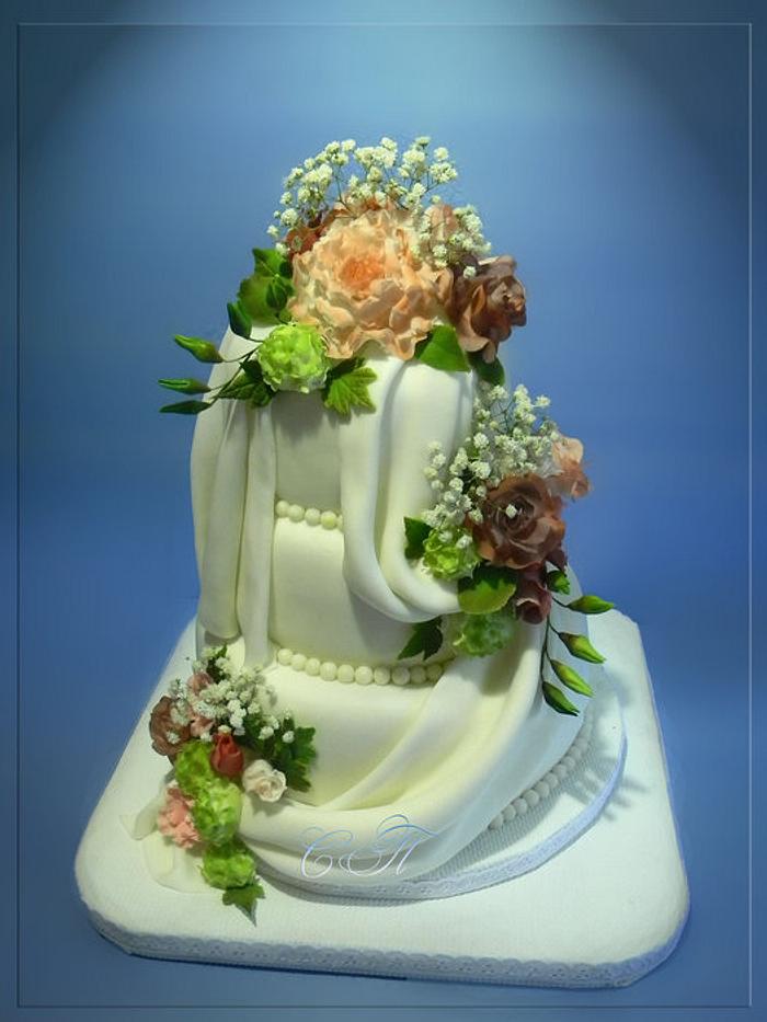 Wedding cake with a bouquet