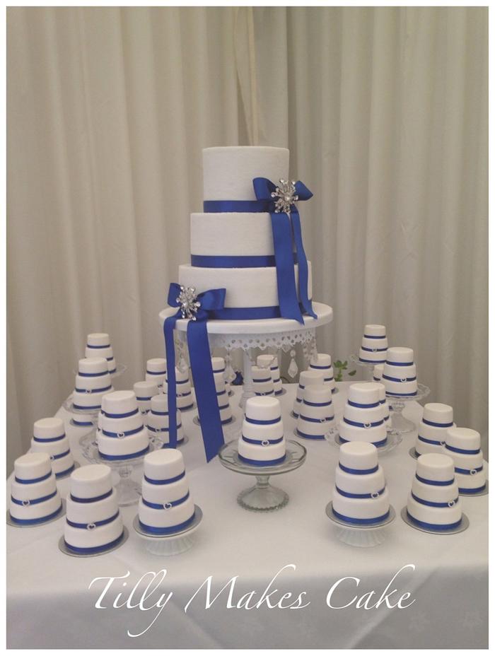 Royal blue wedding cake with matching mini cakes 