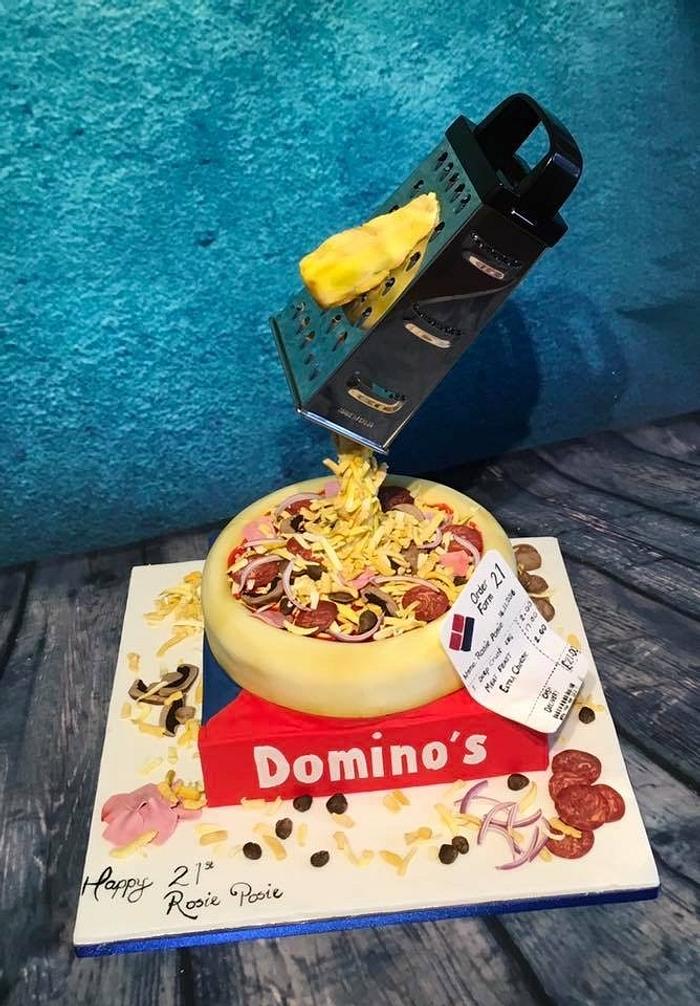 Dominoes pizza gravity defying cake