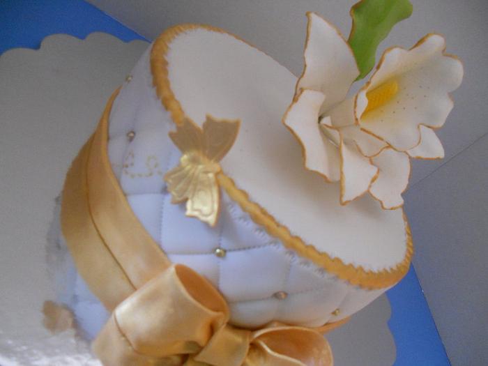Gold and white, orchid birthday cake.