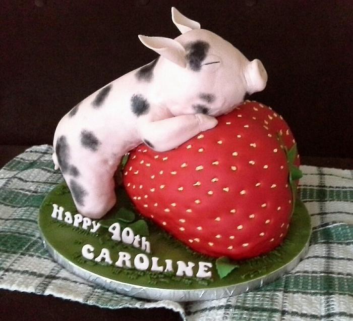 Birthday pig on a strawberry