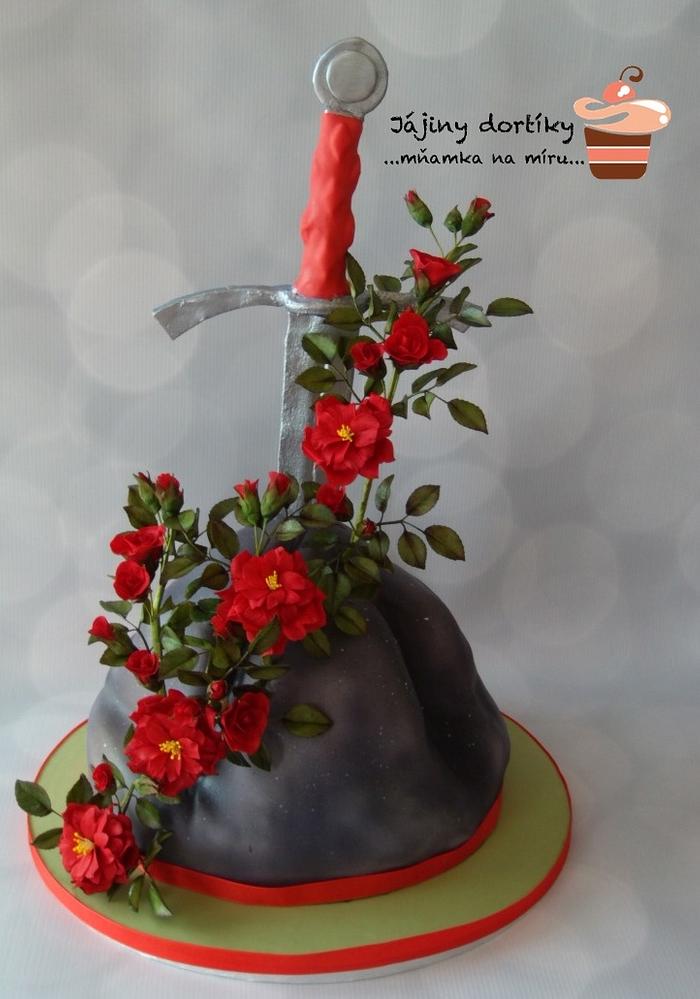 Sword in a stone with climbing roses