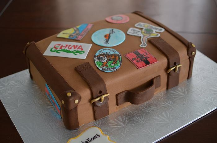 Suitcase cake with hand drawn luggage stickers