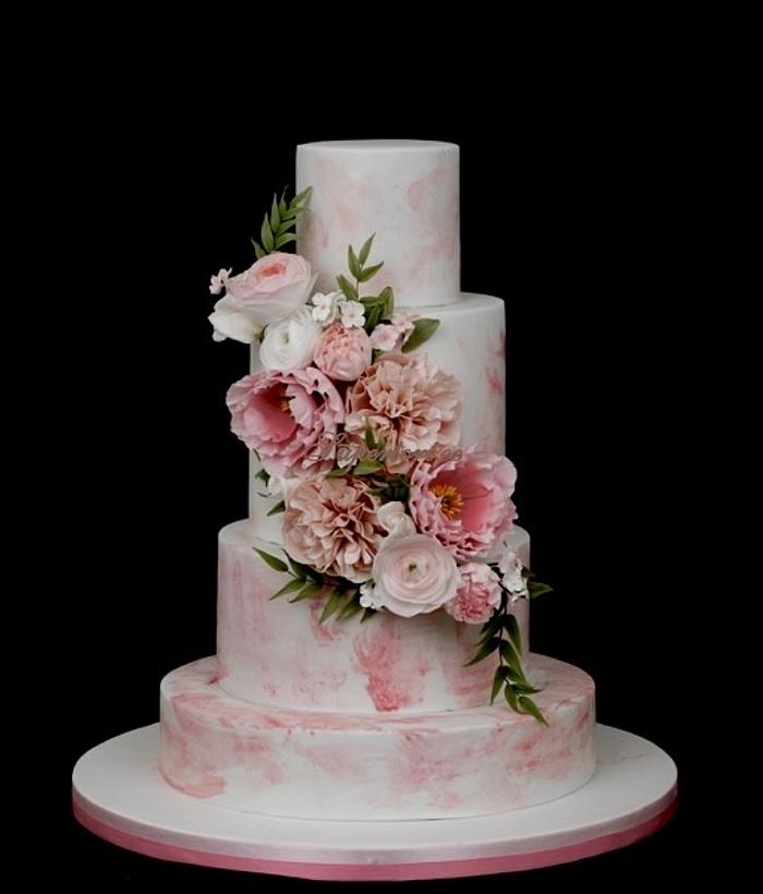 Pink watercolor effect cake with sugarflowers