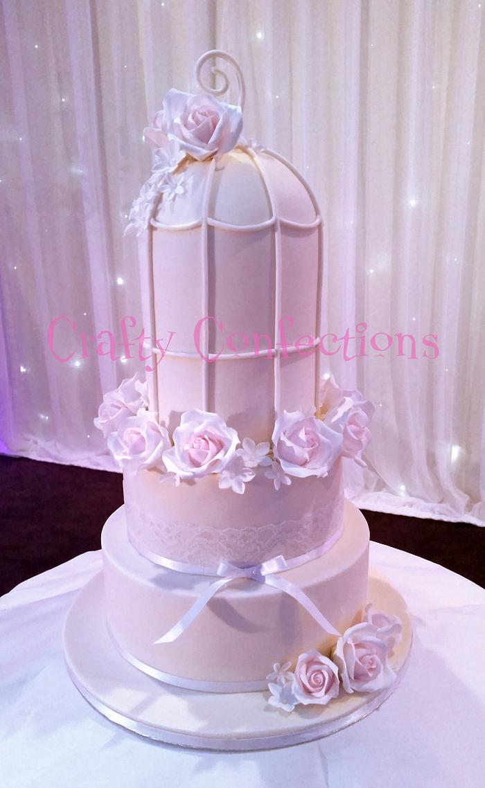 Bird cake and roses wedding cake