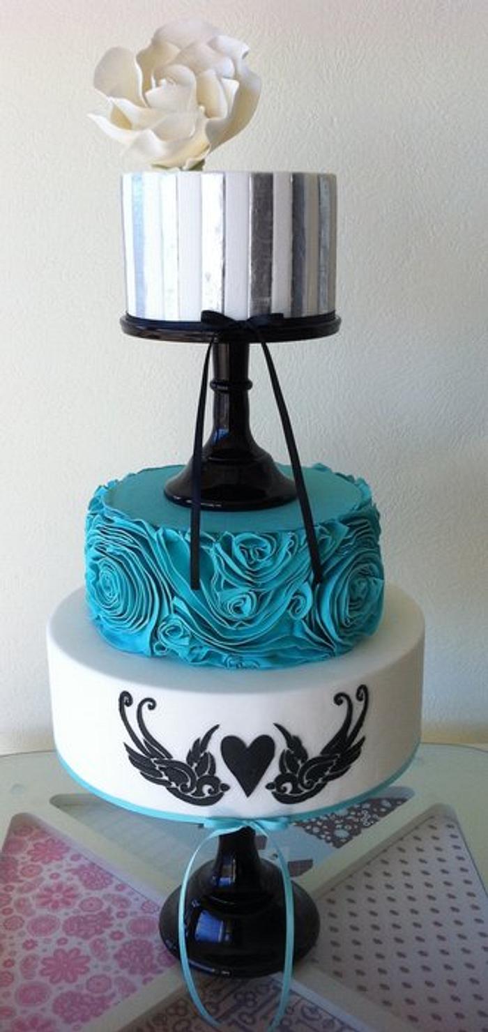 Silver, turquoise, & black themed wedding cake