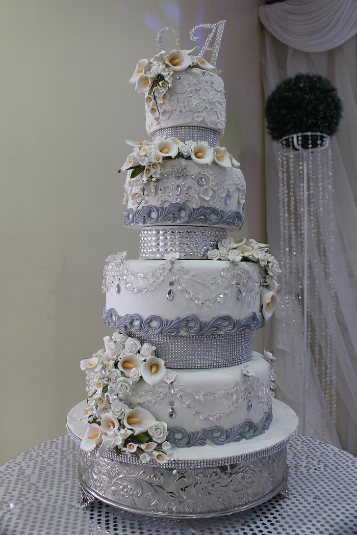 White Wedding Cake with White Floral Accents & Silver Trims