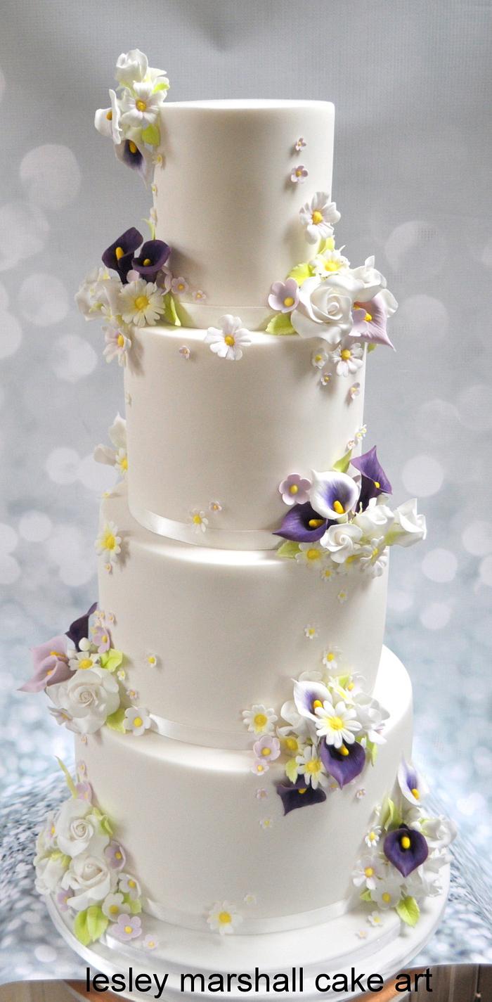 wedding cake with flower posies & clay toppers