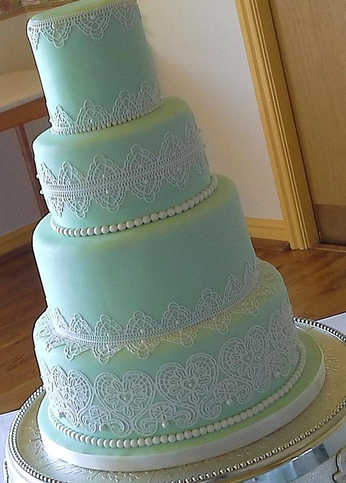 4 tiered pale mint with lace wedding cake
