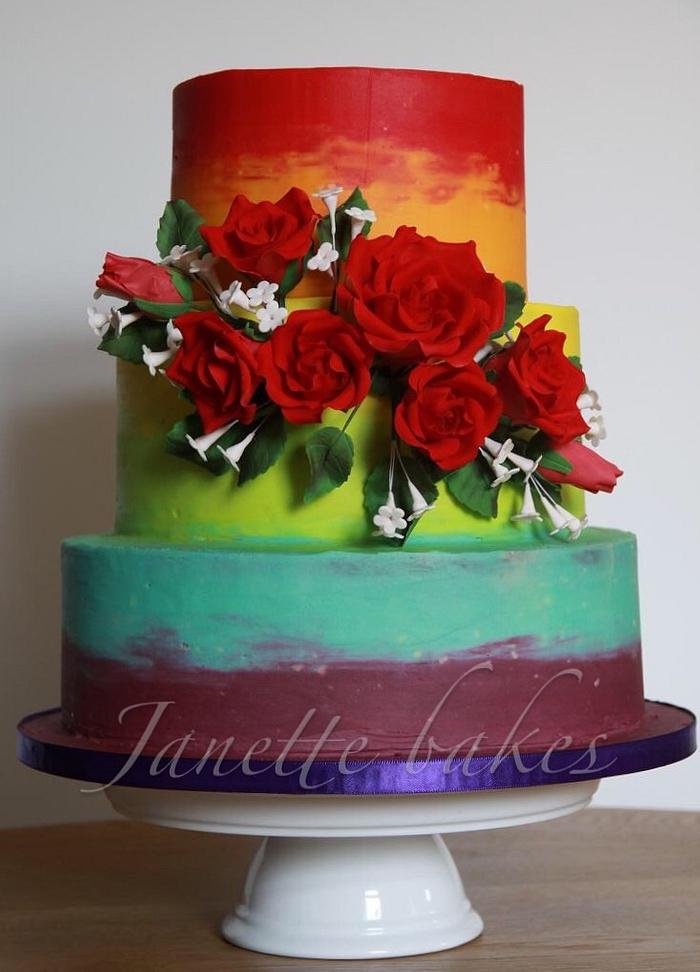 Rainbow cake with red roses