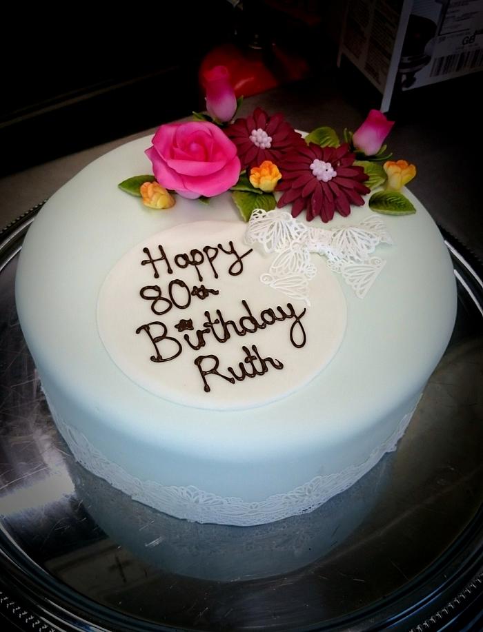 80th birthday floral cake