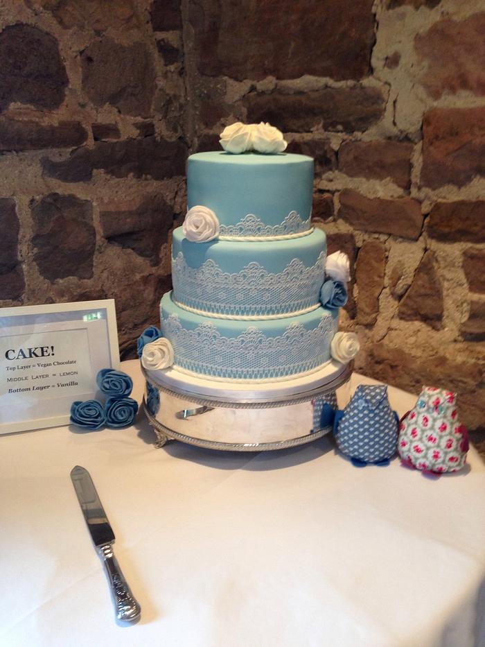 Blue and white lace wedding cake
