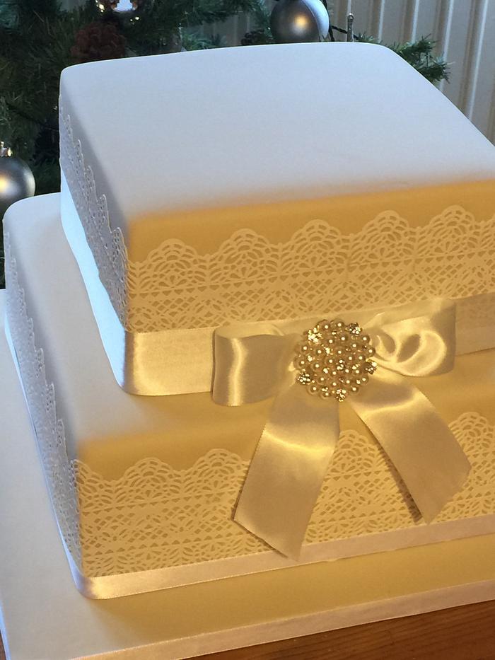 Lace & ribbon wedding cake
