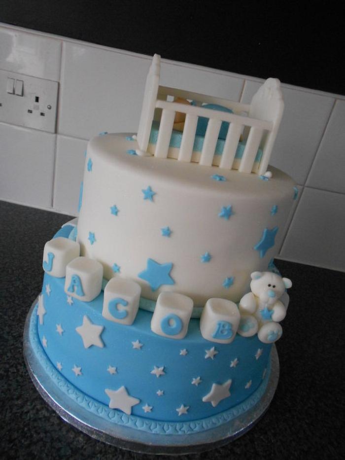 Baby in crib christening cake