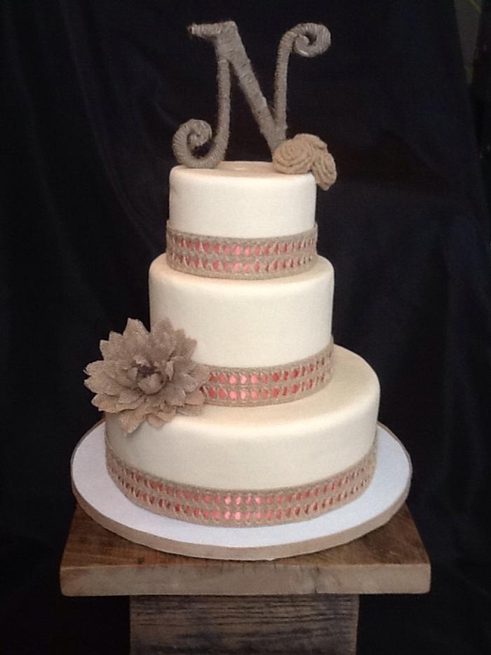 Ivory cake with burlap and ribbon 