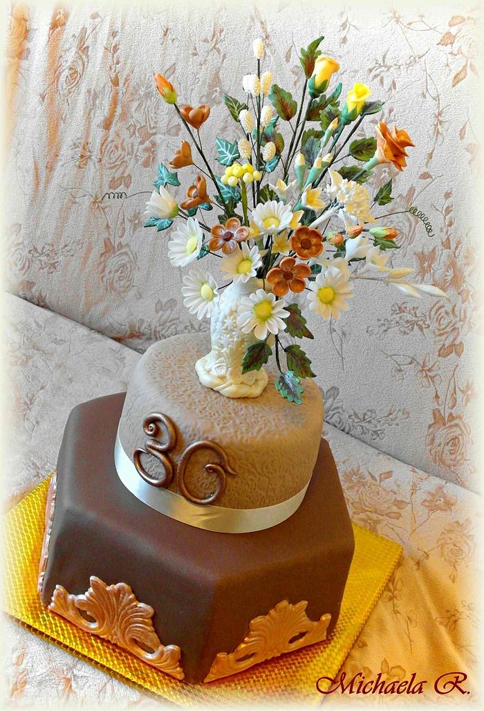 Cake with a vase of flowers